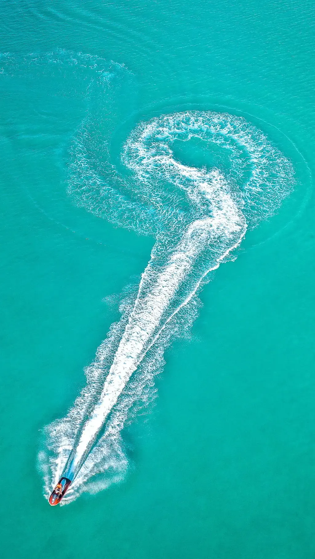 Jet ski seen from above in turquoise water